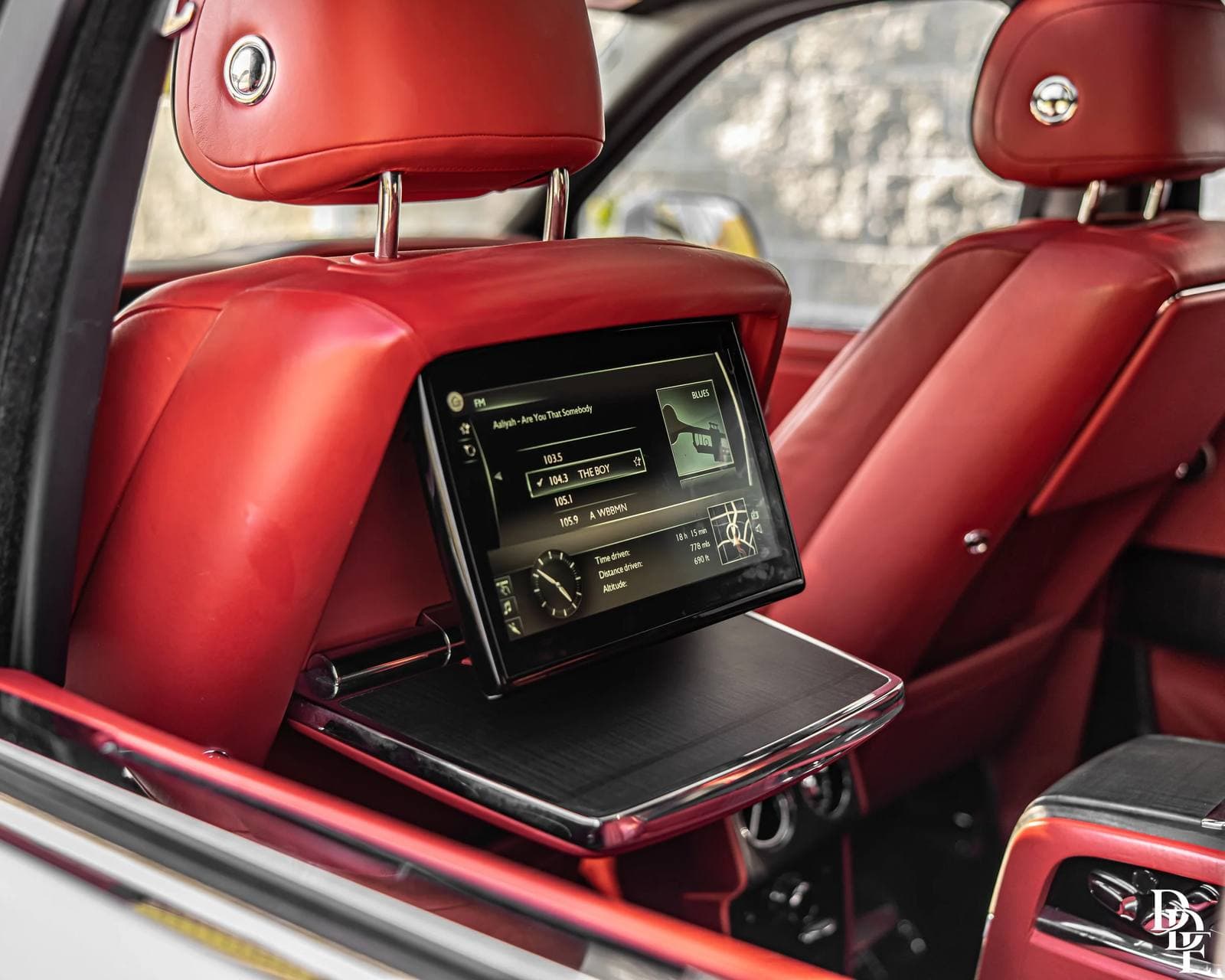 Red leather rear cabin of a Rolls-Royce from the DDE Rentals fleet