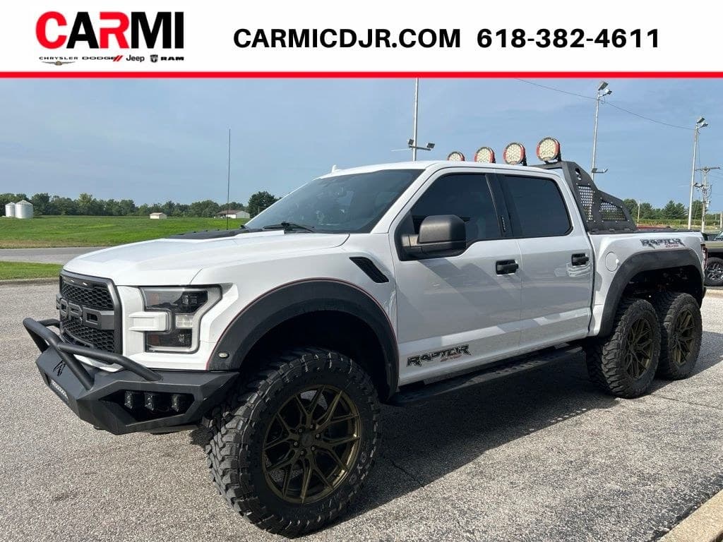 Side view of the Raptor 6x6 — six bronze wheels, chase rack and roof lights