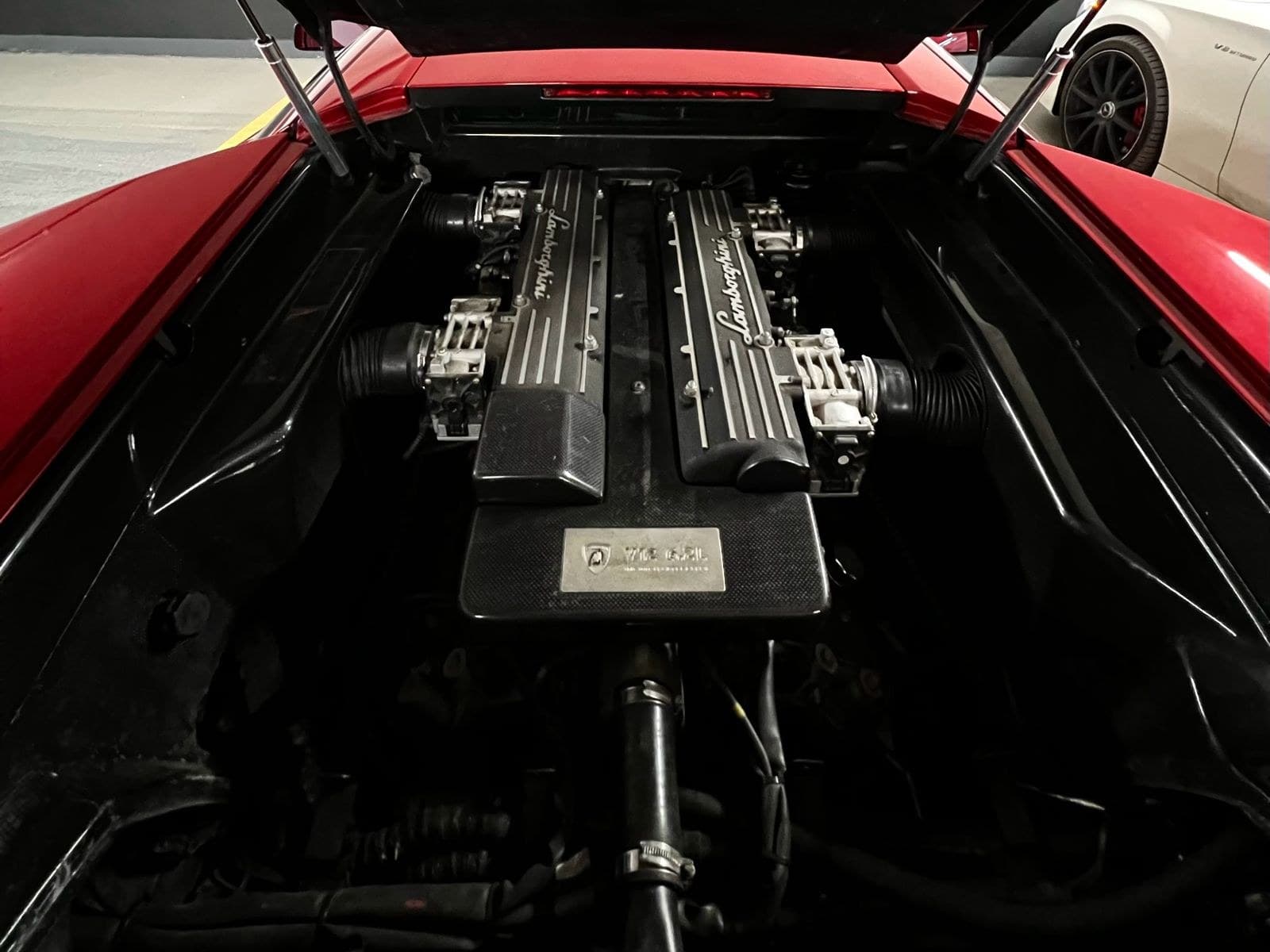 The 6.2-litre V12 under the engine cover of the 2004 Murciélago