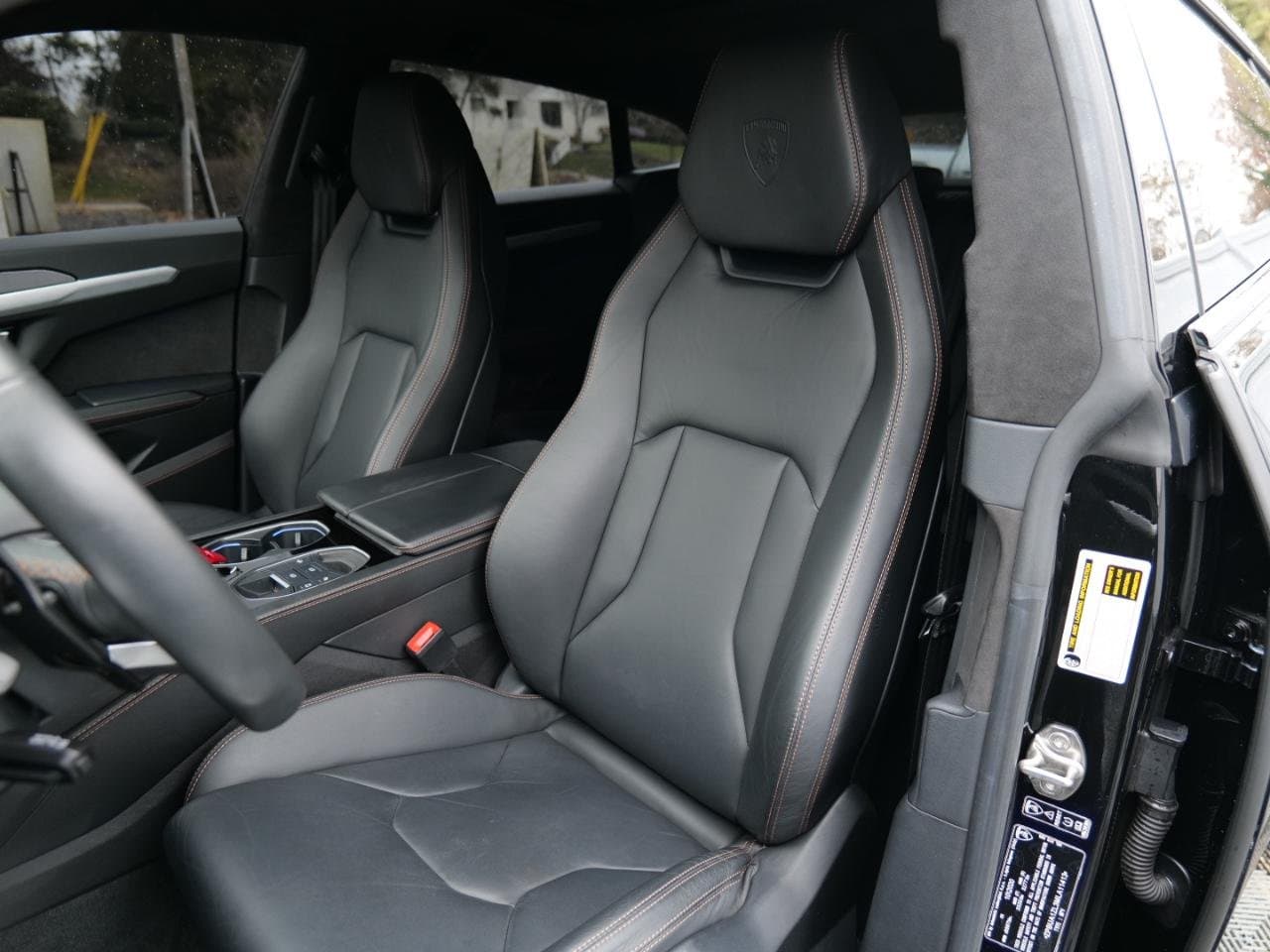 Nero Ade black leather front seats of the Urus with Lamborghini-crest headrests and contrast stitching