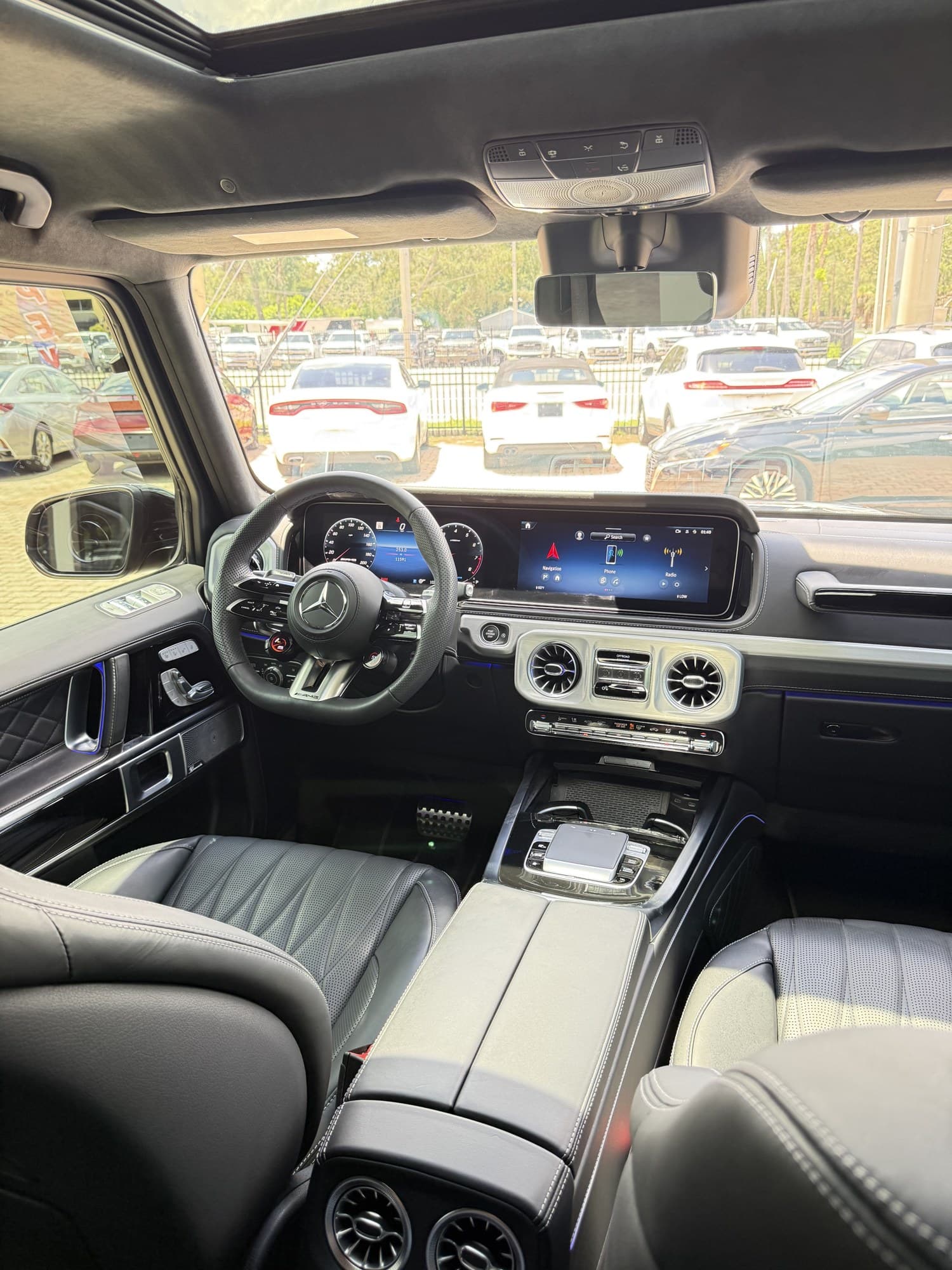 Cockpit of the 2025 G 63 — AMG steering wheel and widescreen dual displays