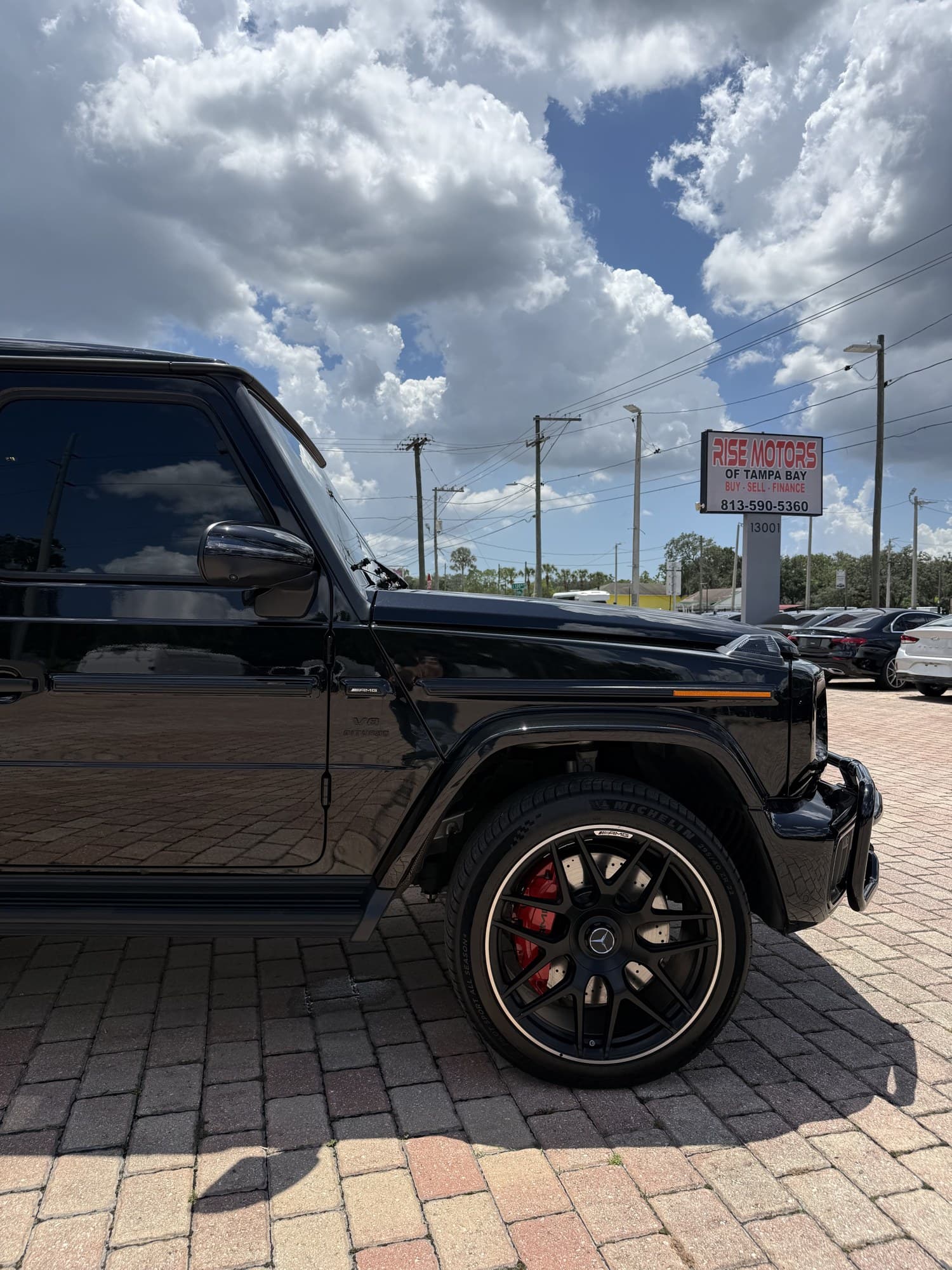 22-inch AMG forged cross-spoke wheel over a red AMG brake caliper