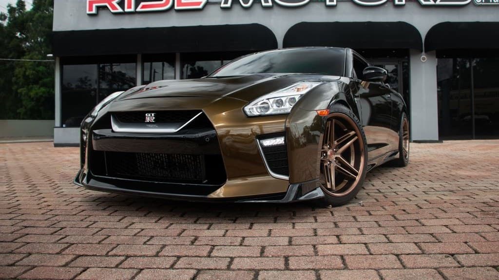 2020 Nissan GT-R Premium in a bronze finish on bronze Ferrada wheels — front three-quarter view, for sale from DDE Rentals