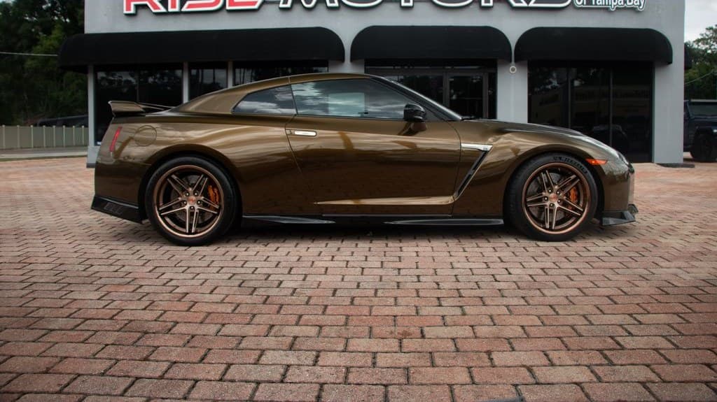 Side profile of the 2020 GT-R Premium showing its bronze finish and concave Ferrada wheels