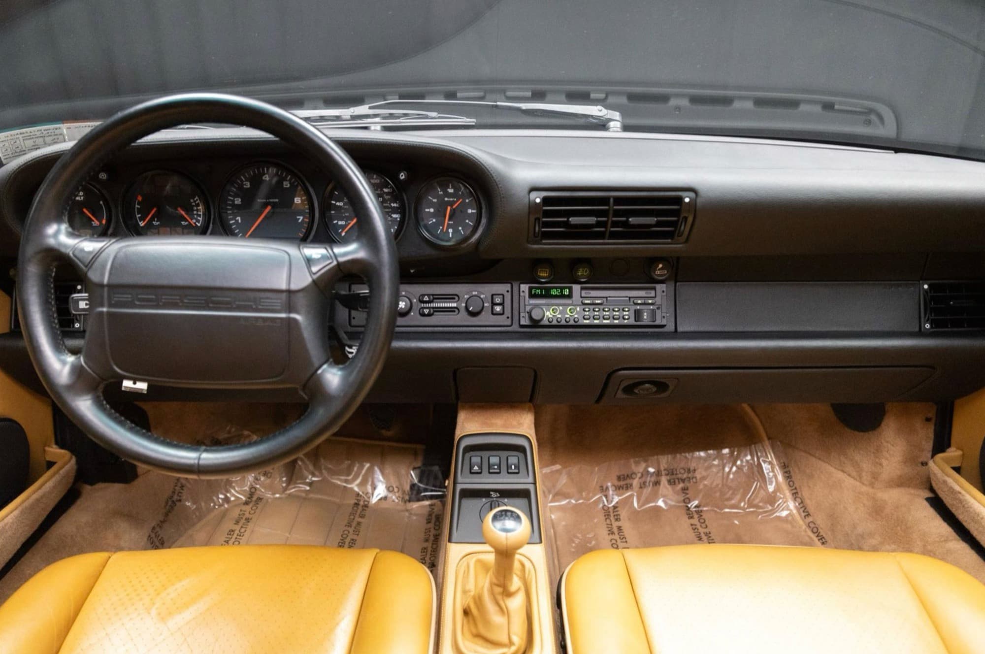 Dashboard of the 1993 Porsche 911 Carrera 2 (964) with period-correct radio