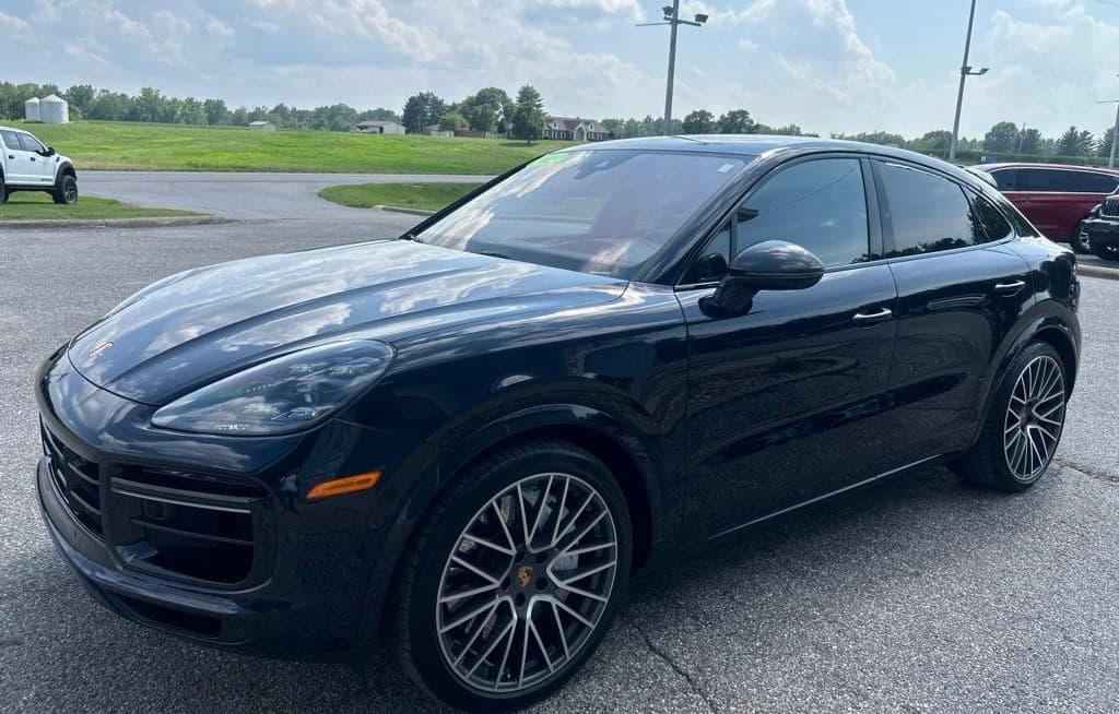 2023 Porsche Cayenne Turbo Coupe in dark blue — front three-quarter view, for sale from DDE Rentals
