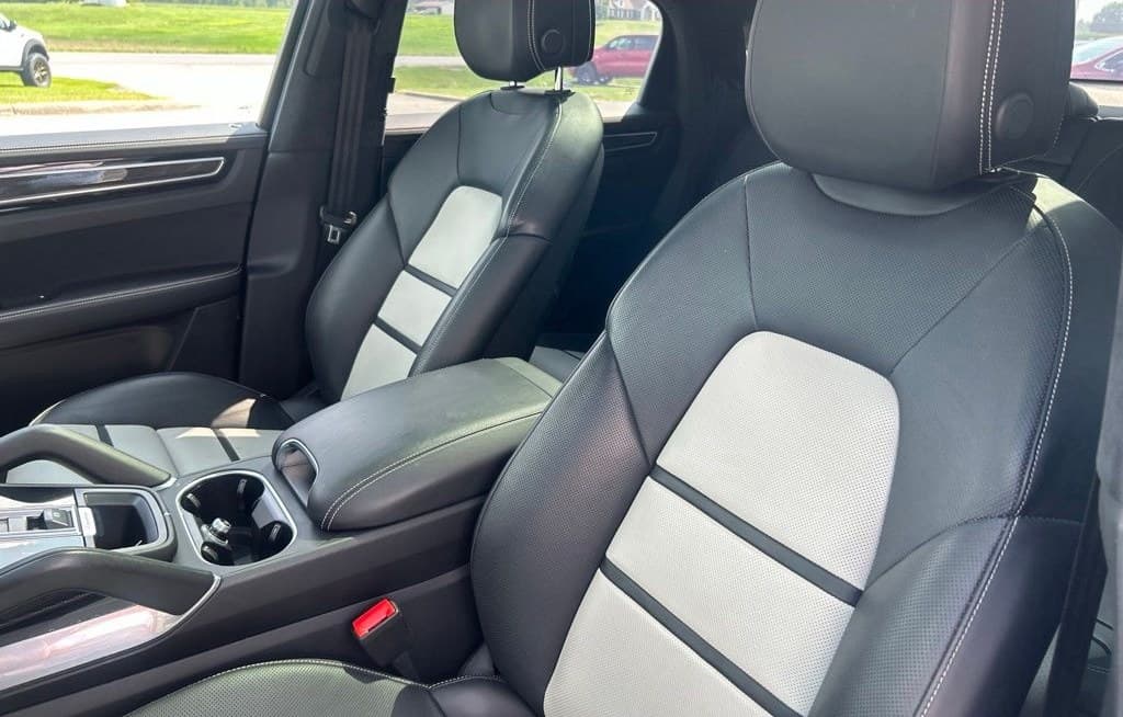 Two-tone black and light grey leather front seats of the Cayenne Turbo Coupe